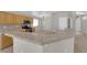 Open kitchen with breakfast bar, tile backsplash and stainless steel appliances at 3228 Jumping Hills Ave, Henderson, NV 89052