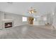 Open-concept living area with hardwood floors and a tile fireplace at 3228 Jumping Hills Ave, Henderson, NV 89052