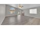 Bright living room with hardwood floors, large windows, and cozy fireplace feature at 3228 Jumping Hills Ave, Henderson, NV 89052