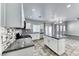 Stylish kitchen featuring white cabinets, granite countertops, stainless steel appliances, and an island with seating at 3425 Bedfordshire Pl, Las Vegas, NV 89129