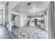 Spacious living area with access to a well appointed kitchen with an island at 3425 Bedfordshire Pl, Las Vegas, NV 89129