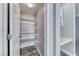 Walk-in pantry with open shelving and stone look tile flooring at 3425 Bedfordshire Pl, Las Vegas, NV 89129