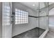 Glass enclosed shower with mosaic tile and a glass block window for natural light at 3425 Bedfordshire Pl, Las Vegas, NV 89129