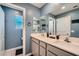 Stylish bathroom with double vanity, modern fixtures, and ample counter space, offering a luxurious experience at 377 Yellow Finch Ln, Henderson, NV 89012