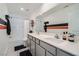 Modern bathroom featuring double sinks with a large mirror and shower-tub combination at 377 Yellow Finch Ln, Henderson, NV 89012