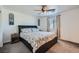 Comfortable bedroom featuring a ceiling fan and side table, designed for relaxation and restful nights at 377 Yellow Finch Ln, Henderson, NV 89012