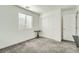 Clean bedroom with white walls, neutral carpet, a window, and closet at 377 Yellow Finch Ln, Henderson, NV 89012