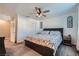 Comfortable bedroom featuring a ceiling fan, closet, and decor accents; designed for relaxation and restful nights at 377 Yellow Finch Ln, Henderson, NV 89012