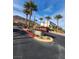 Quail Ridge community entrance sign with palm trees and view of the neighborhood at 377 Yellow Finch Ln, Henderson, NV 89012