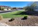 Well-maintained community park and artificial turf with neighborhood homes at 377 Yellow Finch Ln, Henderson, NV 89012