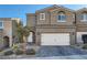 Inviting two-story home with a well-maintained lawn and a two-car garage, perfect for Gathering living at 377 Yellow Finch Ln, Henderson, NV 89012