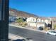 Front view of home featuring well-manicured landscaping and a two car garage at 377 Yellow Finch Ln, Henderson, NV 89012