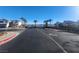 Gated community entrance with palm trees along the entranceway at 377 Yellow Finch Ln, Henderson, NV 89012