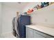 Convenient laundry room featuring a modern washer and dryer with ample storage at 377 Yellow Finch Ln, Henderson, NV 89012