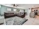 Open-concept living room featuring comfortable sofas and seamless flow to the kitchen at 377 Yellow Finch Ln, Henderson, NV 89012