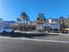 Parking area with desert landscaping near community pool, with mountain views in the background at 377 Yellow Finch Ln, Henderson, NV 89012