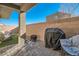 Private patio with brick pavers, outdoor seating, and a built-in brick wall at 377 Yellow Finch Ln, Henderson, NV 89012