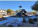 Neighborhood playground equipment with modern surfacing and nearby housing at 377 Yellow Finch Ln, Henderson, NV 89012