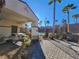 Community pool area with covered seating and dining areas, as well as desert landscaping at 377 Yellow Finch Ln, Henderson, NV 89012