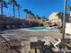 Resort-style community pool with lounge chairs and beautiful desert landscaping and mountain views at 377 Yellow Finch Ln, Henderson, NV 89012