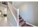 Carpeted stairway with white railing and light blue walls leads to the upper level of the home at 377 Yellow Finch Ln, Henderson, NV 89012
