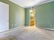 Spacious bedroom featuring neutral carpet, light green walls, and ensuite bathroom access at 38 E Serene Ave # 134, Las Vegas, NV 89123