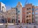 The building has a clock tower, balconies, and bench seating in an inviting outdoor space at 38 E Serene Ave # 134, Las Vegas, NV 89123
