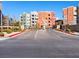 Paved entrance showcases the community's attractive landscaping and convenient visitor parking at 38 E Serene Ave # 134, Las Vegas, NV 89123