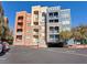 Charming three-story building with stacked stone accents, private balconies and covered parking at 38 E Serene Ave # 134, Las Vegas, NV 89123