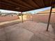Backyard featuring a covered patio, brick wall, and open space at 3936 Rive Gauche St, Las Vegas, NV 89115