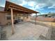 Backyard with covered patio, brick pavers, and partial fencing at 3936 Rive Gauche St, Las Vegas, NV 89115