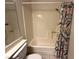 Bathroom showing the shower/tub with a flower shower curtain at 3936 Rive Gauche St, Las Vegas, NV 89115