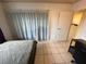 Bedroom featuring a bed, desk, and bright natural light through the window at 3936 Rive Gauche St, Las Vegas, NV 89115