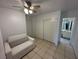Bright bedroom with seating and storage with access to bathroom at 3936 Rive Gauche St, Las Vegas, NV 89115
