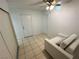 The bedroom has a neutral chair, ceiling fan, and a closet at 3936 Rive Gauche St, Las Vegas, NV 89115