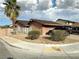 Exterior of a single-Gathering home showcasing desert landscaping, block wall and a two car garage at 3936 Rive Gauche St, Las Vegas, NV 89115
