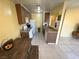 Kitchen and dining area with brown cabinets, countertops, and essential appliances at 3936 Rive Gauche St, Las Vegas, NV 89115