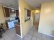 Simple kitchen area featuring a white range and access to other rooms at 3936 Rive Gauche St, Las Vegas, NV 89115