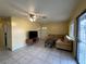 Inviting living room with cozy sofa, TV, and ample natural light at 3936 Rive Gauche St, Las Vegas, NV 89115