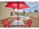 Backyard with table and chairs, and a view of the swimming pool at 4431 El Campana Way, Las Vegas, NV 89121
