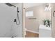 Modern bathroom featuring a marble tile shower with a matte black shower head and fixtures at 4431 El Campana Way, Las Vegas, NV 89121