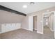 Bedroom featuring carpeting, built in closet, beamed ceiling and an adjacent bathroom at 4431 El Campana Way, Las Vegas, NV 89121
