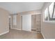 This bedroom features a carpeted floor, built in closet, large window and neutral walls at 4431 El Campana Way, Las Vegas, NV 89121