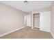Cozy bedroom featuring neutral paint, carpet, and closet with white sliding doors at 4431 El Campana Way, Las Vegas, NV 89121
