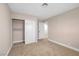 This carpeted bedroom features a sliding door closet and a doorway to another room at 4431 El Campana Way, Las Vegas, NV 89121
