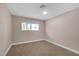 Neutral bedroom with large window and plush carpeting offers a soothing retreat at 4431 El Campana Way, Las Vegas, NV 89121