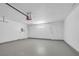 Clean garage with white walls, concrete floor and two entry doors at 4431 El Campana Way, Las Vegas, NV 89121