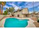 A sparkling pool and patio create a backyard oasis for relaxation and entertaining with mature desert landscaping at 4431 El Campana Way, Las Vegas, NV 89121