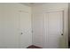 Hallway area showing a closet with sliding doors and a standard entry door at 4825 Shea Stadium Ave, Las Vegas, NV 89139