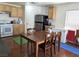 Efficient kitchen space adjacent to a dining area with essential appliances at 4825 Shea Stadium Ave, Las Vegas, NV 89139